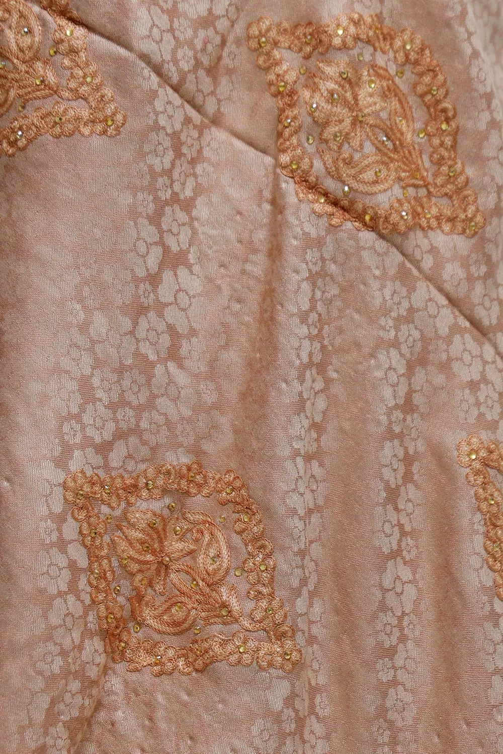 Fawn Colour  Stole Enriched With Aari Embroidery And A Touch Of Swarovski Looks Elegant.